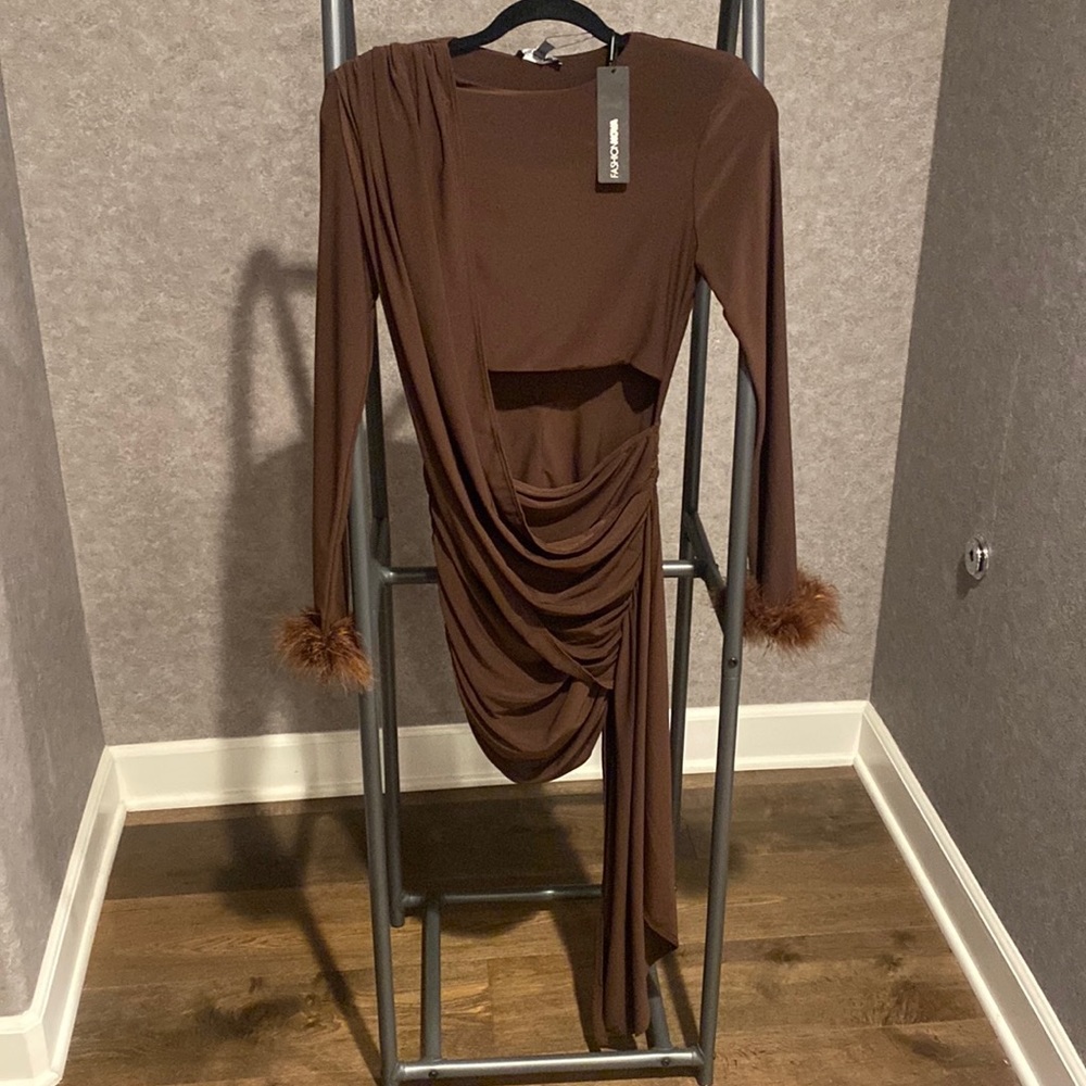 Brown long sleeve mini dress. Mini side train, fur trim sleeves. Size medium